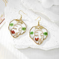 Gold Tone Abstract Face Pressed Flower Drop Earrings in Five Designs view 5
