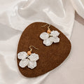 Four White Petal Flower Bead Hook and Clip Earrings view 2