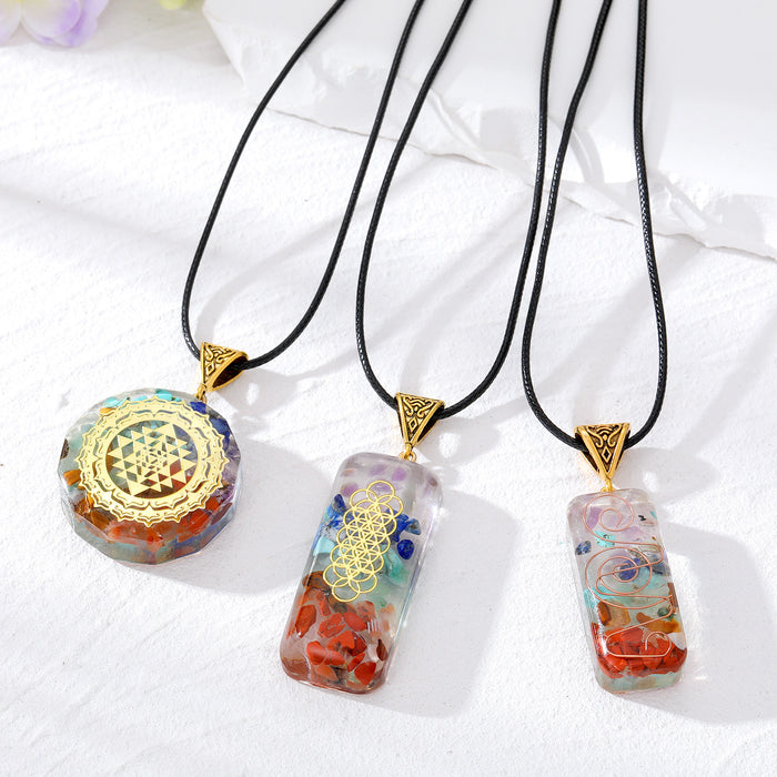 Antique Gold Tone Patterned Resin Pendants on Black Cords