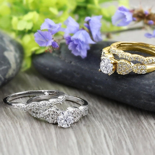 Angled product view of clear stone marquise ring sets in gold and silver tone finishes
