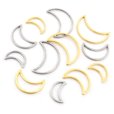 Overview of open crescent moon charms in gold and silver tones across three sizes on a light background