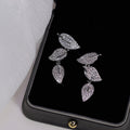 Silver-Tone Three-Leaf Linear Drop Earrings with Clear Stone Details view 1
