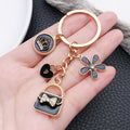 Five Fashion Handbag Lipstick and Crown Metal Keychain Designs view 3