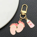 Eight Pink and Blue Baby Bottle Footprint Keychain Designs view 3
