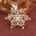 Gold Snowflake Brooch with Clear Baguette Crystals view 3