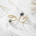 Twisted Band Blue Evil Eye Open Rings in Four Finishes view 2