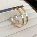 Oversized Polished Hoop Earrings with Distinctive Textured Details view 7