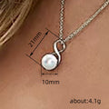 Silver Tone Infinity Twist Pendant Necklace with White Faux Pearl view 4