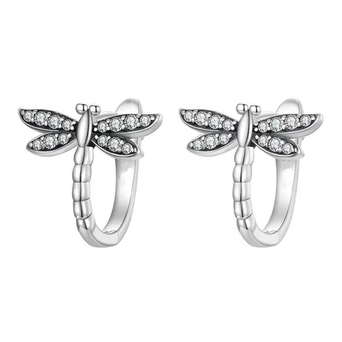 White metal dragonfly huggie pair product shot on white