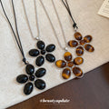 Black Flower Oval Cabochon Pendant Cord Necklace Silver Frame view 3