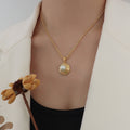 Gold Rope Chain Necklace with Spiral Disc Faux Pearl Pendant view 1