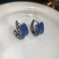 Gunmetal Blue Crystal Huggie Earrings in Wing and Block Shapes view 1