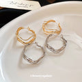 Wavy Open Hoop Earrings In Polished Gold And Silver Tones view 2