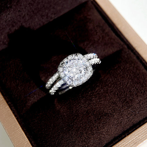 White gold cushion halo dual-band ring stacked in brown velvet box
