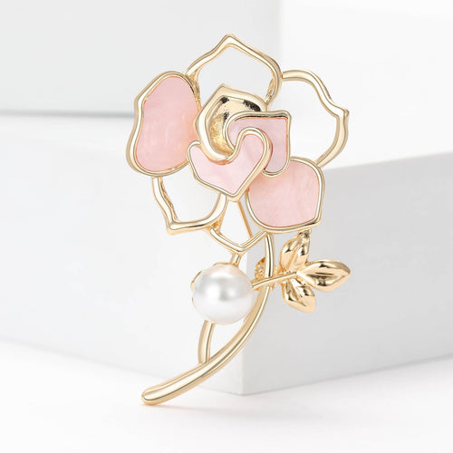 Pink mother of pearl camellia brooch on gold stem