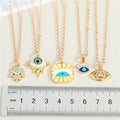 Gold Tone Evil Eye and Hamsa Pendant Necklaces in Five Designs view 5
