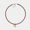 Dark Red Beaded Necklace with Gold Tone Bell Pendants view 5