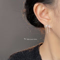 Silver Outline Bow Ribbon Polished Metal Stud Earrings view 2