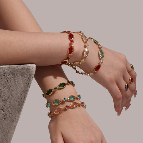 Arms stacked with multicolor marquise Czech glass gold bracelets