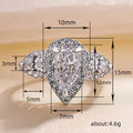 Pear-Shaped Solitaire Three-Stone Halo Ring In Silver Tone view 5