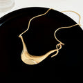 Sculptural Curved Pendant Necklace in Gold and Silver view 6