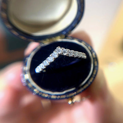 Product view showing silver-tone V-shaped pave chevron ring