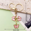 Butterfly Charm Keychains Featuring Blue Butterfly Across 35 Pictured Variations view 9