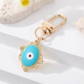 Gold Tone Filigree Oval Teardrop and Star Evil Eye Clip Keychains view 8