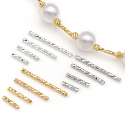 Rose gold-tone faceted tube beads arranged on a light background