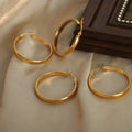 Large Polished Oval O-Hoop Earrings Gold Tone Metal view 3