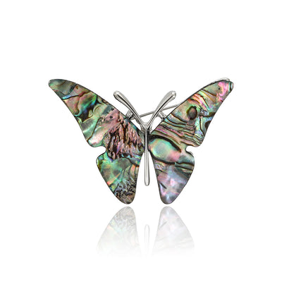 A butterfly with mosaic-like iridescent shell wings shown on a white background.