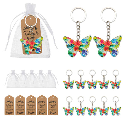 Packaging overview showing floral butterfly keychains, white organza bags, and printed thank-you tags.