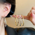 Textured Metal Hoop Earrings in Gold and Silver Two Sizes view 1