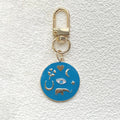 Gold Tone Round Enamel Eye and Celestial Clip Keychains view 4