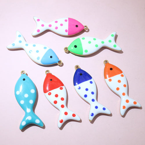 Finish comparison of polka dot enamel fish charms in eight color options