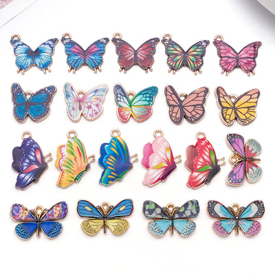 Colorful butterfly charms arranged on a light background