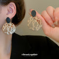 Gold Tone Openwork Disc Earrings With Black Oval Studs view 1