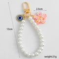 Pearl Beaded Wristlet Keychain with Evil Eye and Glitter Flower Charm view 3