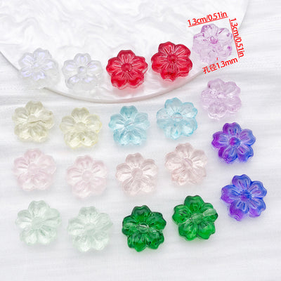 Transparent glass cherry blossom beads arranged as a full product overview