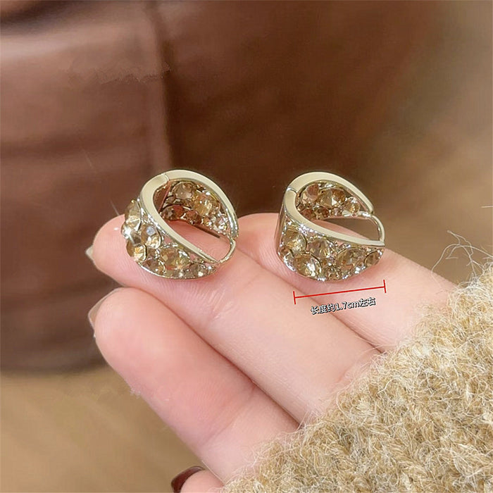 Gold Tone Rounded U Huggie Earrings with Clear Crystal Inlay