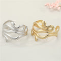 Gold and Silver Tone Snake and Starfish Open Cuff Bracelets view 1