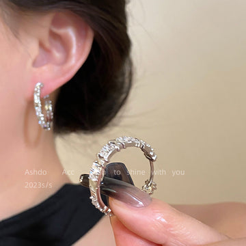 Clear Faceted Stone Crossover Huggie Hoop Earrings