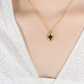 Gold Oval Black Stone Pendant Necklace Geometric Frame view 1