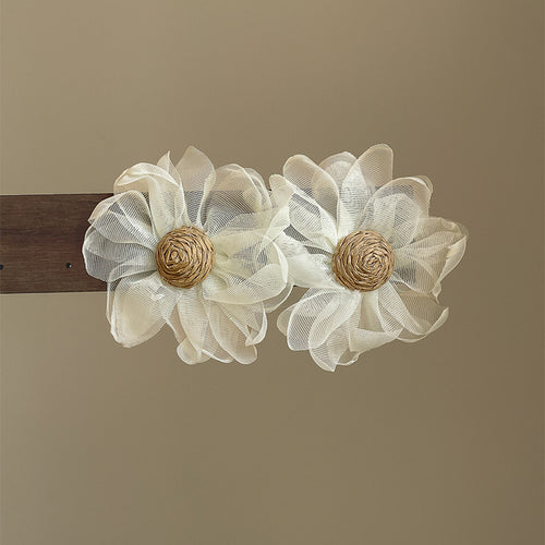 White Fabric Flower Stud Earrings with Woven Centers shown in a display view