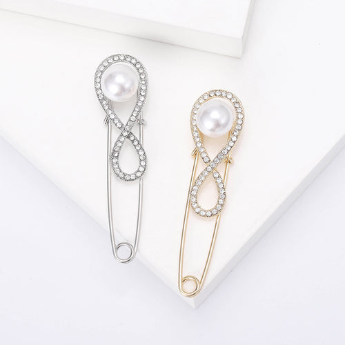 Front view of the infinity loop pearl safety pin brooch in silver and gold brooch and its color options