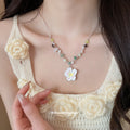 White Daisy Pendant Necklace with Green and Brown Beads view 3