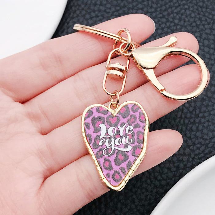 Four Purple Pink and Red Printed Heart Metal Clasp Keychain Designs