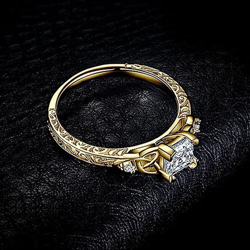 Second product view showing square clear solitaire Celtic-knot ring in two metal tones