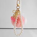 Faux Fur Pompom Charm With Pearl Beaded Strap And Bow view 7