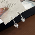 Silver Tone Flower Outline Pearl Look Hook Earrings view 3